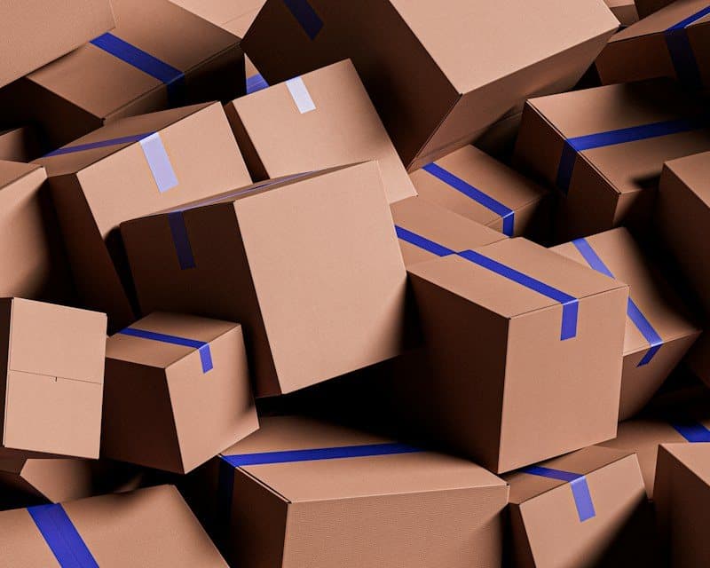 Sealed and labelled moving cartons stacked and ready for storage