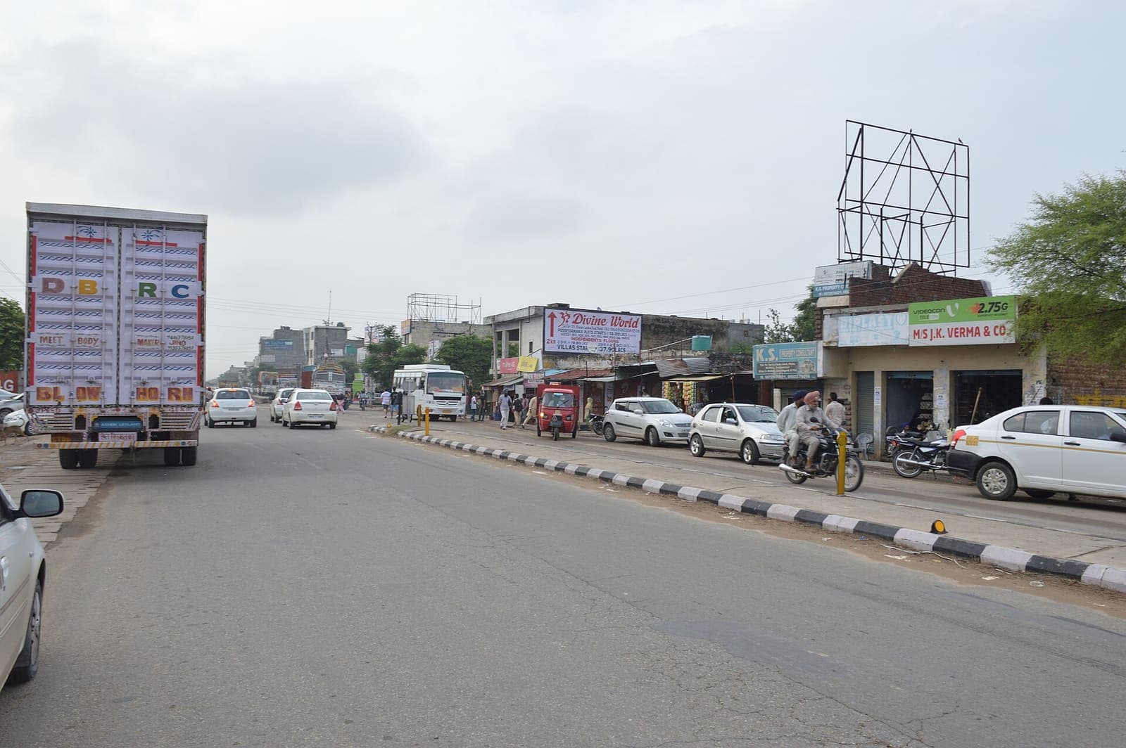 A truck, cars and roadside shops on the Kharar-Banur highway at Landran