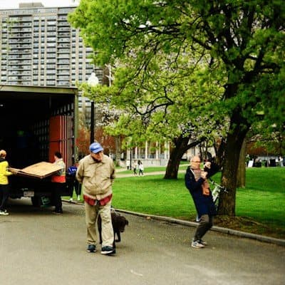 Movers unloading furniture from a truck